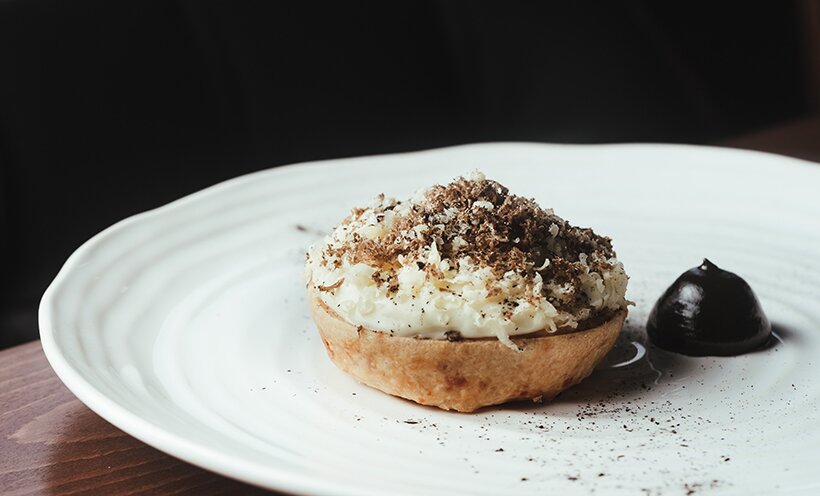 Leek and Cheddar tart with pickled walnut ketchup and English black winter truffles