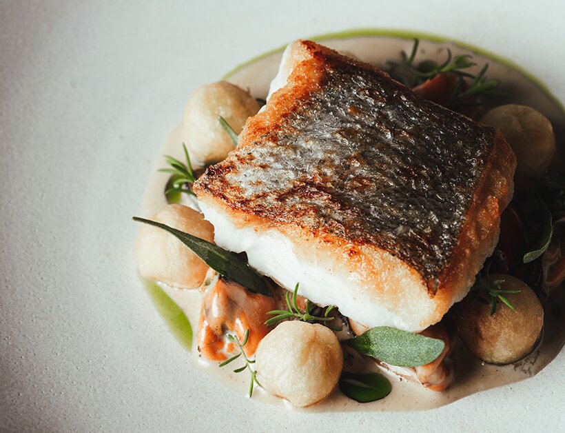 Roast fillet of hake with stout and mussels in stout cream